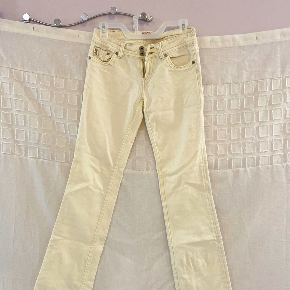 White jeans with flower wait design